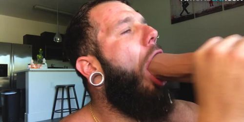 Bearded jock rides huge dildo while masturbating for jizz