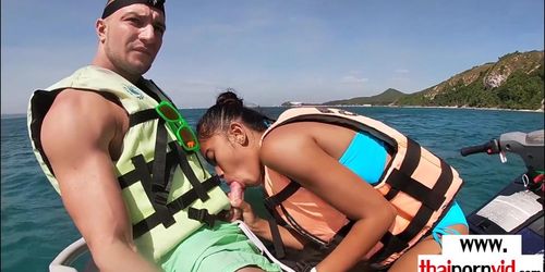 Skinny amateur Thai teen Cherry giving blowjob on a jet ski outdoor