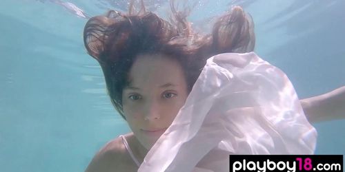 Petite Russian beauty Katya Clover showing her shaved pussy under the water