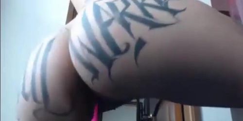 fake-breasted tattooed latin cam-slut