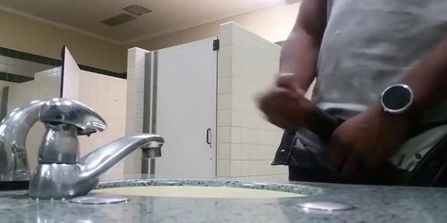 Black perv caught jerking in restroom