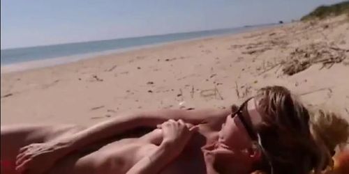 Girl masturbating by the sea