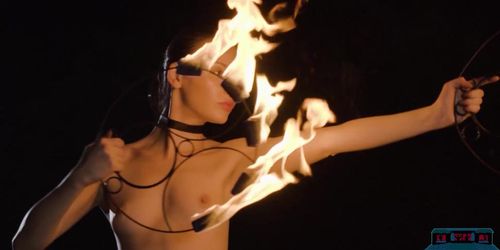 Czech MILF beauty Elilith Noir playing with fire in the nude for Playboy