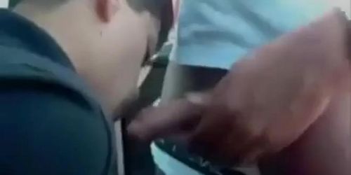 Sucking a cock seated in his car