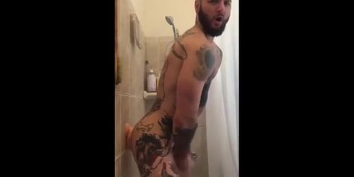 Tatted Hunk Fucks Dildo in Shower Until He Cums