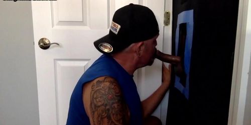 Inked mature sucking off and wanking gloryhole dong