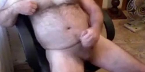 Hairy daddy bear stoking his cock