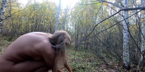 Nude Picking mushrooms in the forest