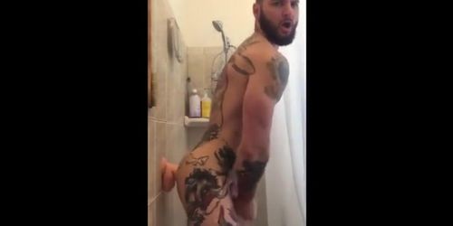 Tatted Hunk Fucks Dildo in Shower Until He Cums