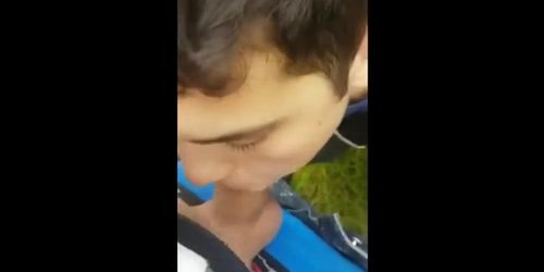 Twink sucking cock in the park and getting the cum