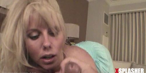 MILF with big tits sucking on a big dick