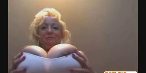 Slutty blonde granny shows huge tits