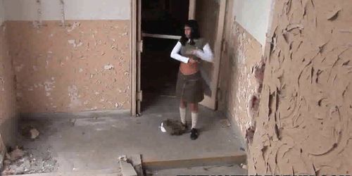 Brunette babe taking on a pair of cocks in an abandoned