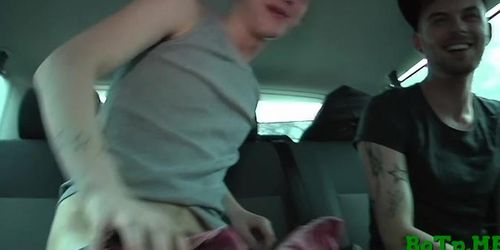 Gays tease each other in a car