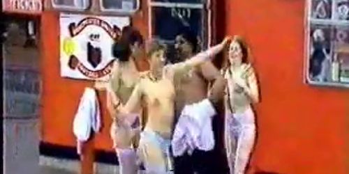 3 Girls Stripping in front of a crowd