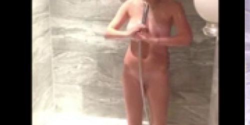 Big boobed teen in shower spied.