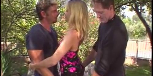 Blonde wife is fucked by two studs in front of her husb