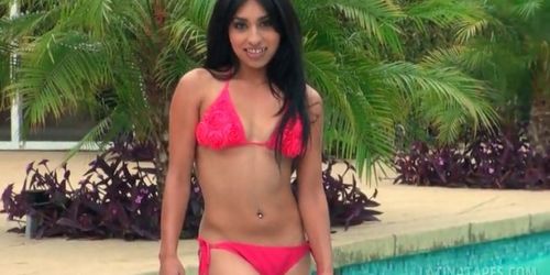 Gorgeous latina takes off her swim suit by the pool