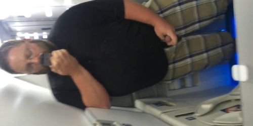 Chub stroking in an airplane bathroom