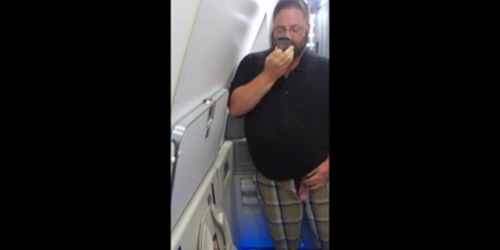 Chub stroking in an airplane bathroom