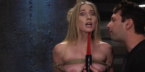 Blonde slave gets zapper in bondage