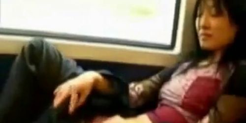 Asian milf rubs her clit on a train