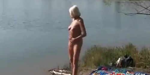 Girl playing w stranger at lake 2