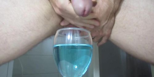 Ejaculating creamy cumshot into a cup of water 2