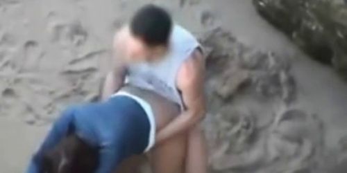 Naughty couple fucking on public beach