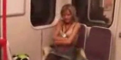 Sexy blonde strips and masturbates in public train