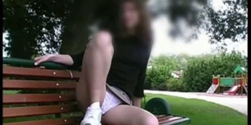 brunette Virginie upskirt in a park