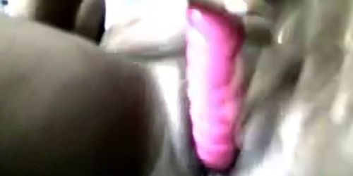 Ebony girl playing with vibrator