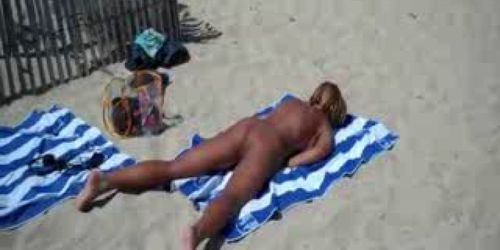 My hot bitch rubbing pussy at nude beach. Public nudity