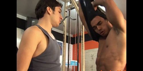 Muscular latin hunk bareback riding cock in gym