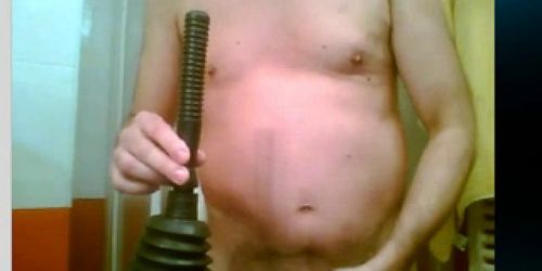 a gay man with plunger in ass