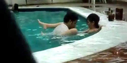 Spanish couple fucking in public swimming pool