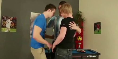 Three guys on a pool table