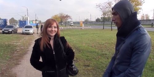 Busty redhead blowjob in a park