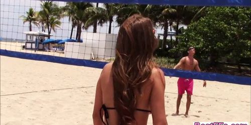 Lovely ladies play two kinds of balls on the beach