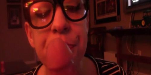 Geeky girl with glasses teasing a lucky guys big dong