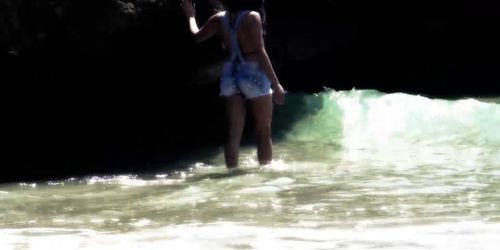 Slim Spanish Latina fucks herself on the beach