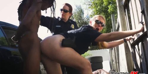 Kinky officers make a criminal fuck their pussies in lo