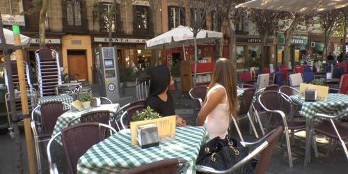 Brunette smoking in public cafe outdoor