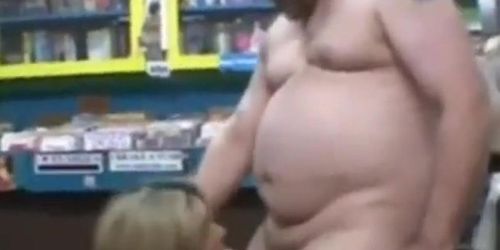 Woman randomly sucks a dirty video store clerk