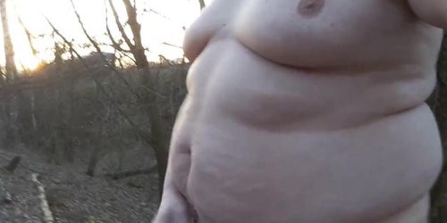 Chubby masturbates in the woods