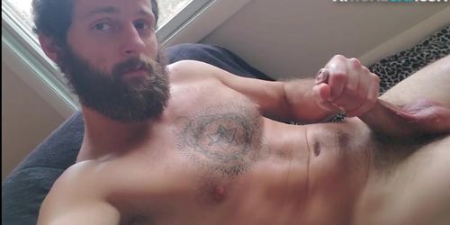 Tattooed otter solo tugs his dick for cumshot