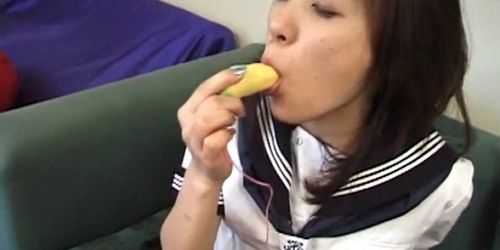 Innocent teen Asian sucks a banana and a loaded pecker