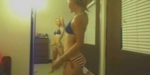 Teen dances in front of mirror