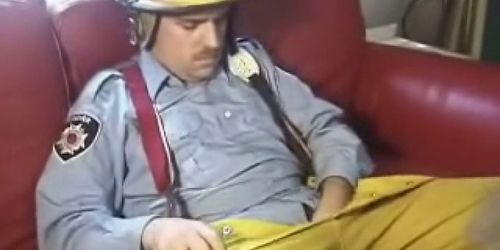 Bear Firefighter plays with his cock