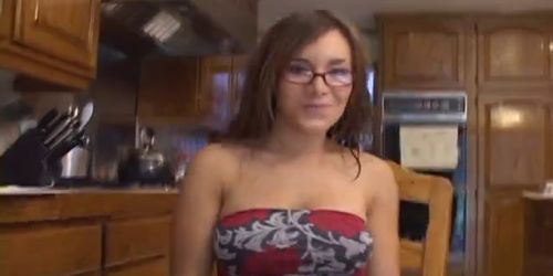 Brunette student in glasses gets distracted from homewo